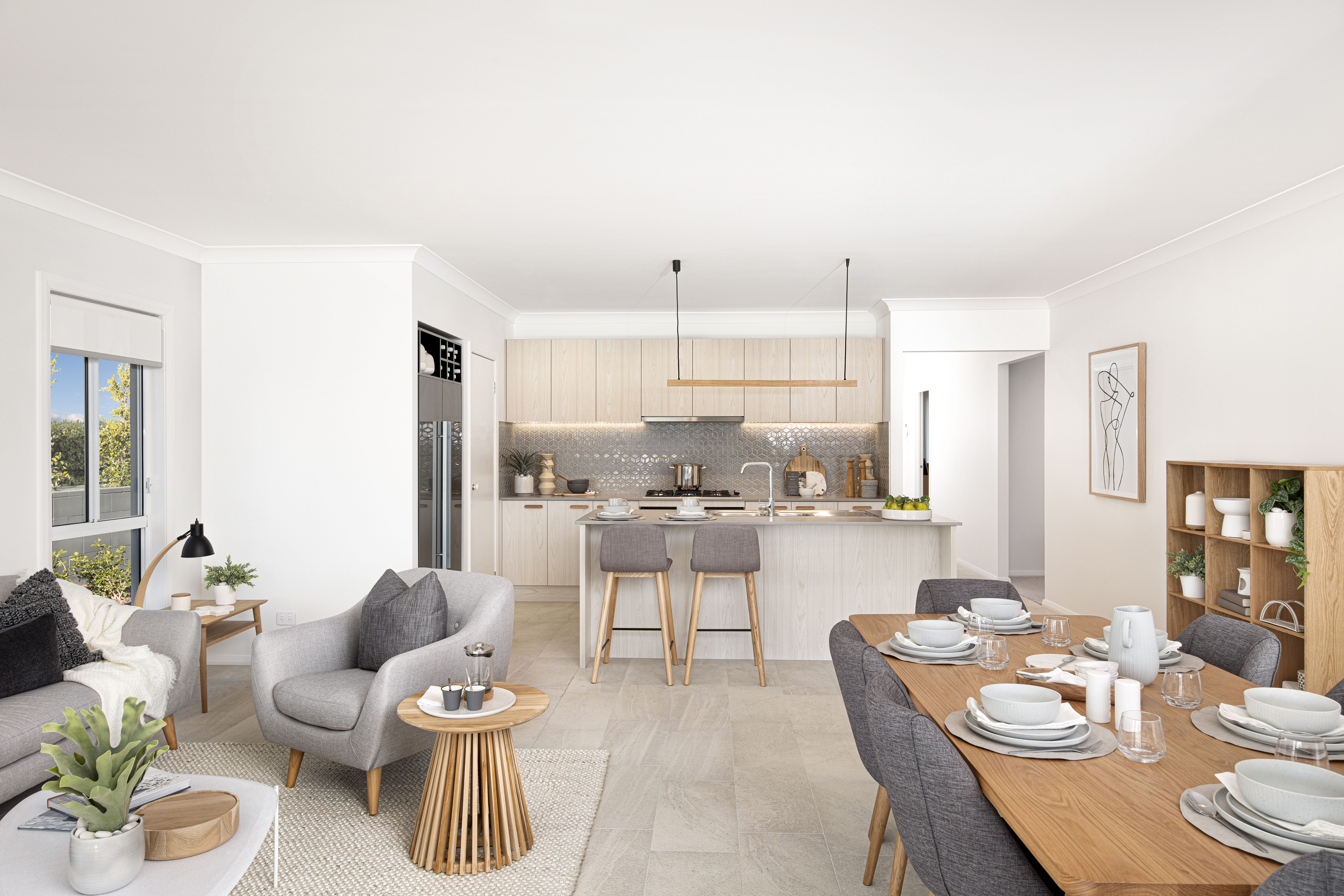 View of the kitchen in the Lucia One display home from the middle of the open plan living and dining areas
