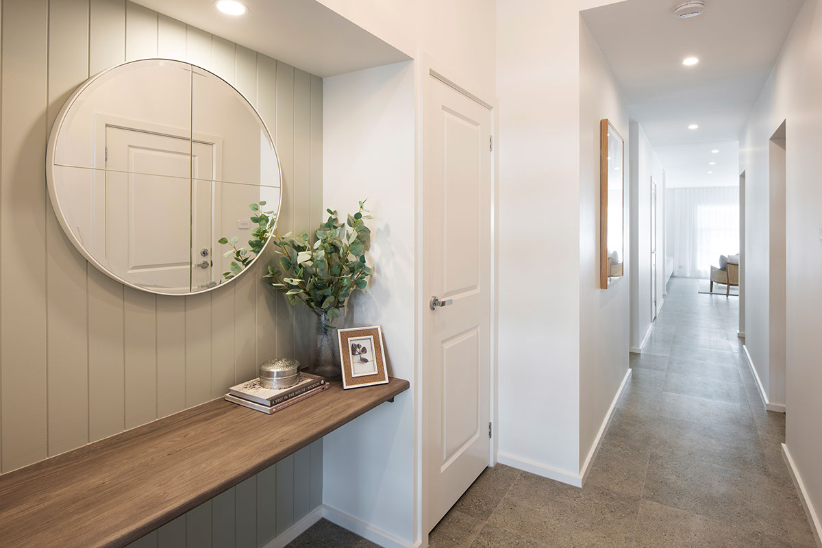 Hallway table and hall from the front door to the open plan living, kitching and dining area of the Avalon 220 display home