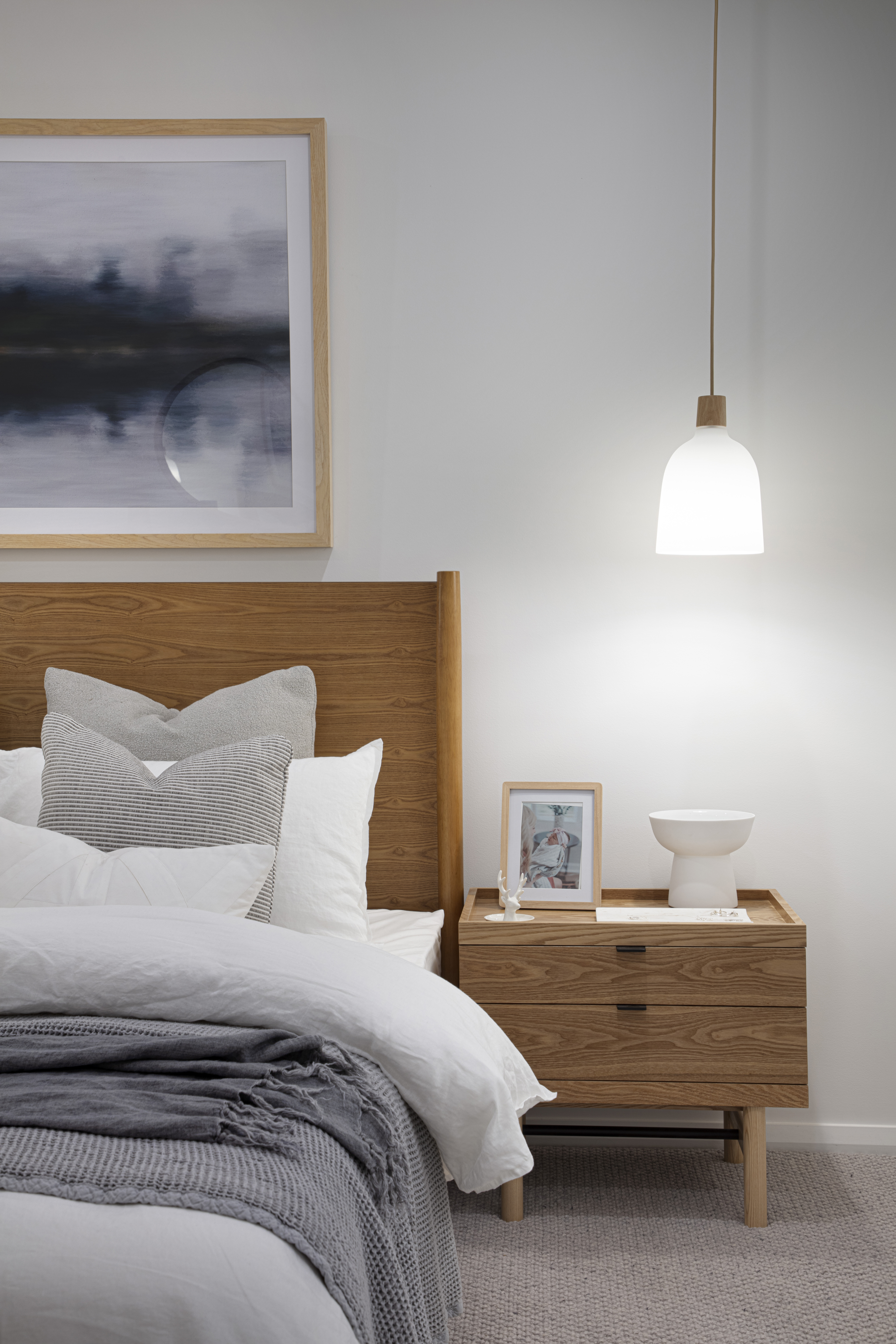 Close up of the bedside table arrangement in the master bedroom of the Lucia One display home