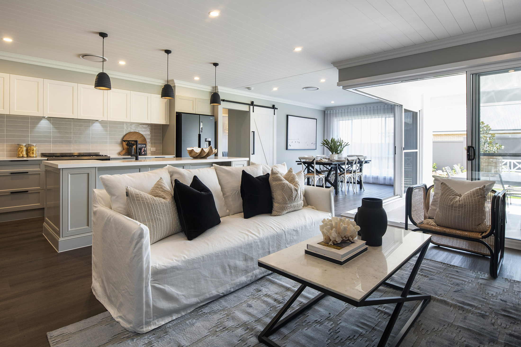 Hamptons style open plan living, kitchen and dining area in the Avoca display home by Montgomery Homes