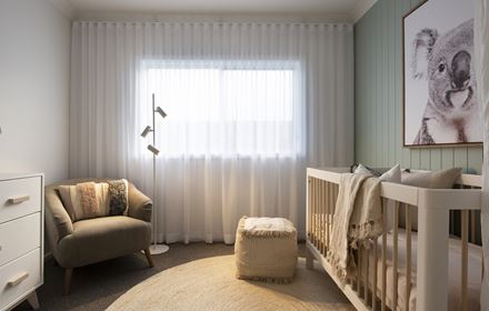 A bedroom styled as a nursery in the Avalon 220 display home with crib below a wall mounted painting of a koala
