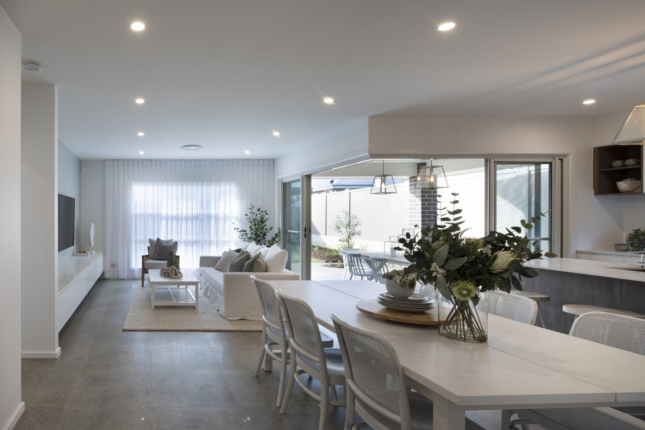 View of the open plan dining, kitchen and areas in the Avalon 220 display home