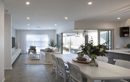 View of the open plan dining, kitchen and areas in the Avalon 220 display home