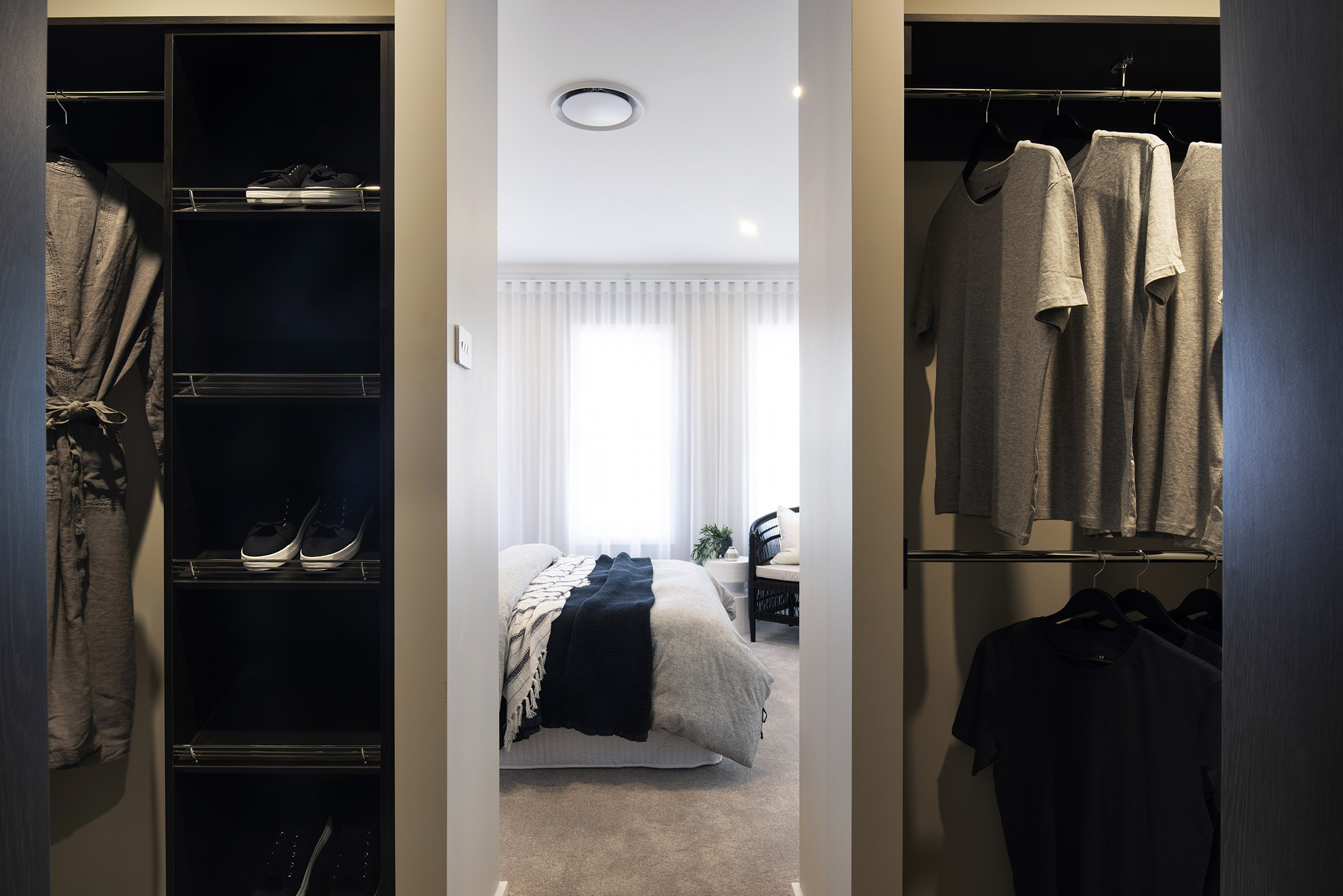 View into the bedroom of the Avoca display from within the walk in wardrobe