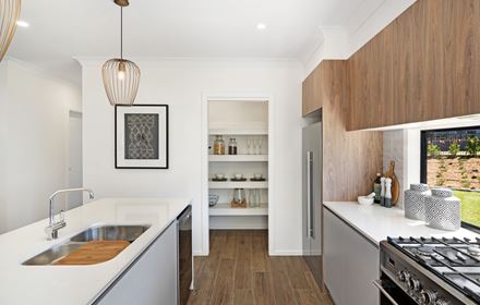 View from within the kitchen of the pantry in the Ellerton 223 display home