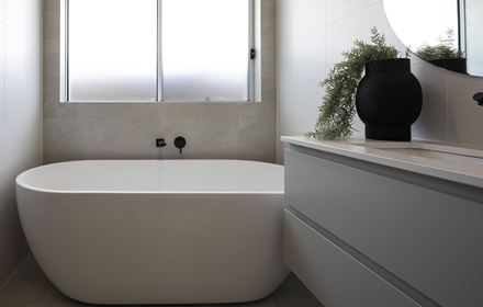 A close up of the freestanding bathtub below a window in the Avoca display home