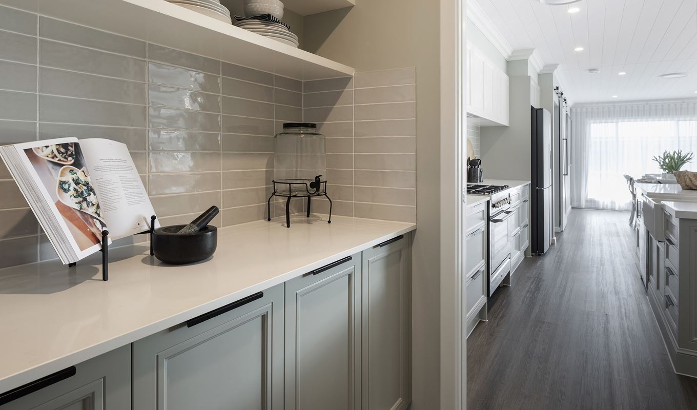 A portion of the scullery opening up to the kitchen in the Avoca display home